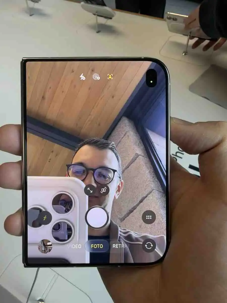 Author testing the iPhone Duo's inner-screen camera preview in an Apple Store