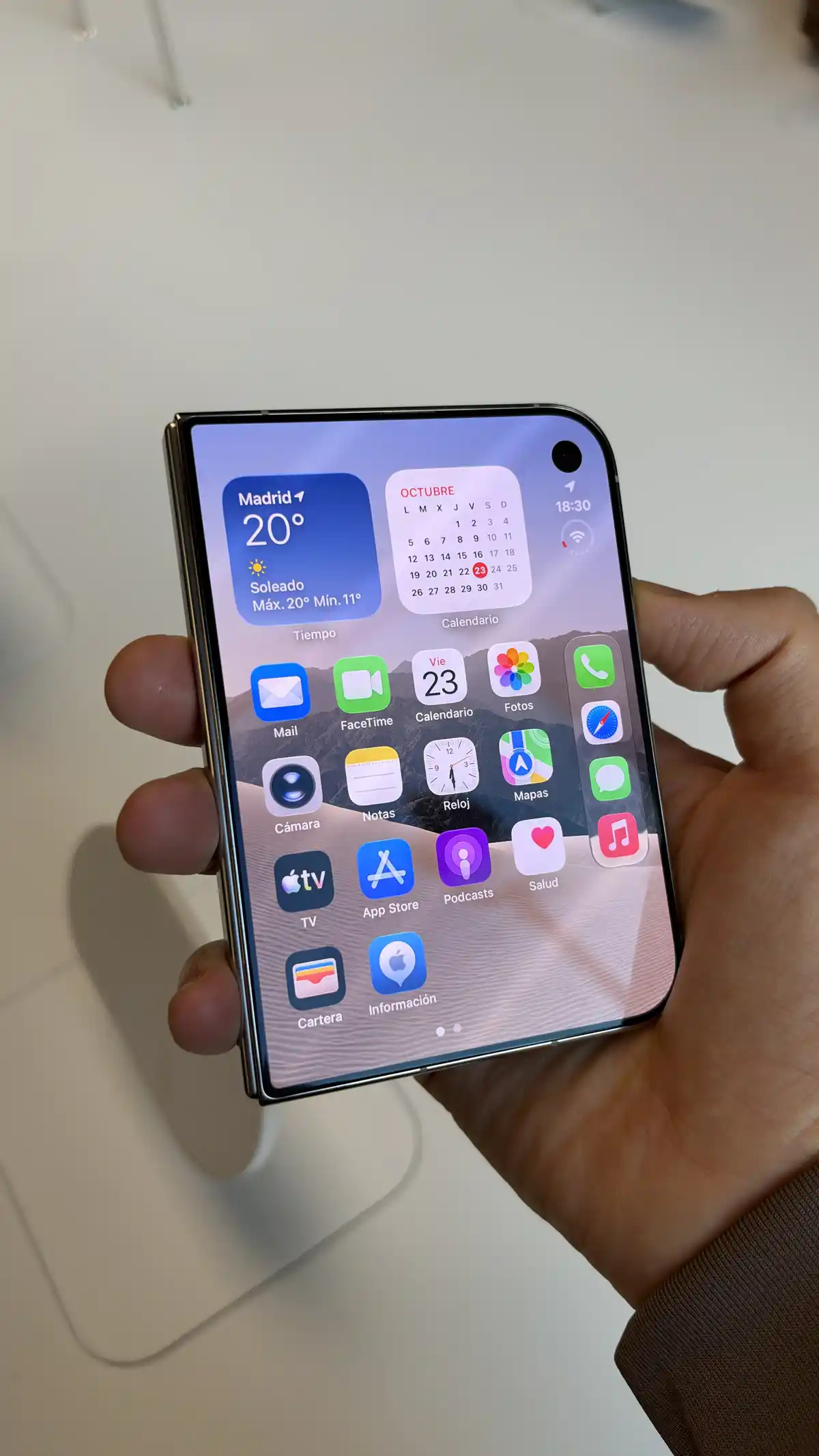 iPhone Duo held at an angle with its display open and folding edge visible
