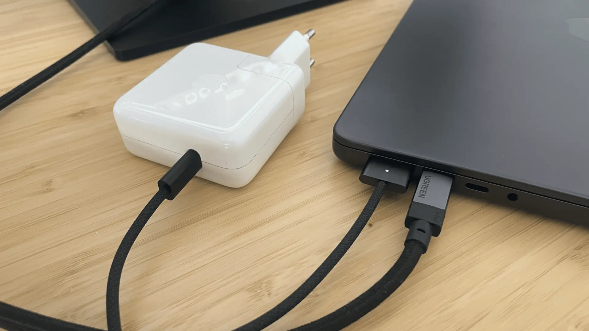 MacBook Pro M4 Pro with MagSafe charger, USB-C cable, and desk peripherals