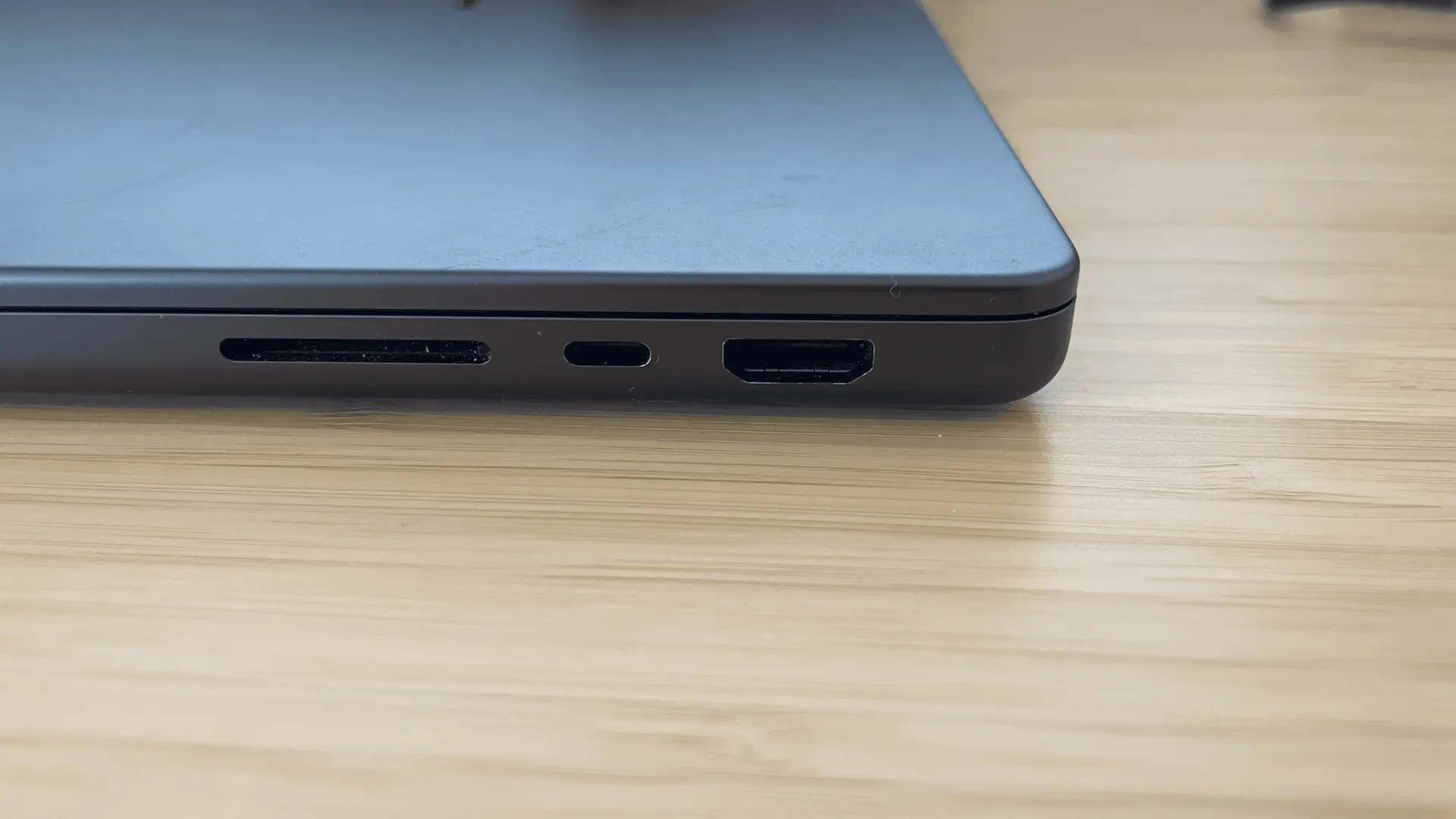 Close-up of MacBook Pro M4 Pro SD card slot, Thunderbolt port, and HDMI port